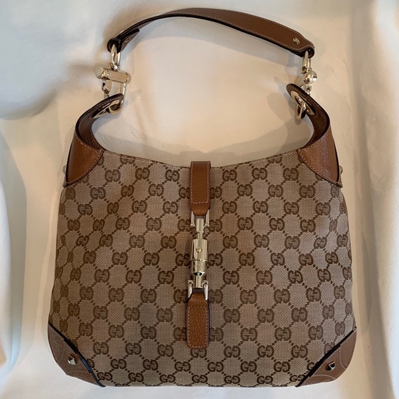 Gucci Handbags - Gucci GG Print Canvas With Leather Strap Hobo Bag.